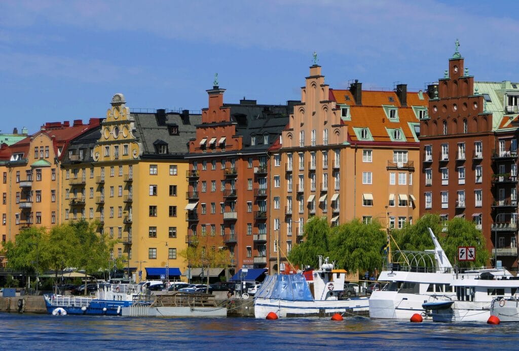 Classic Stockholm buildings along the waterfront in Stockholm, Sweden, one of the safest European cities for solo female travelers.