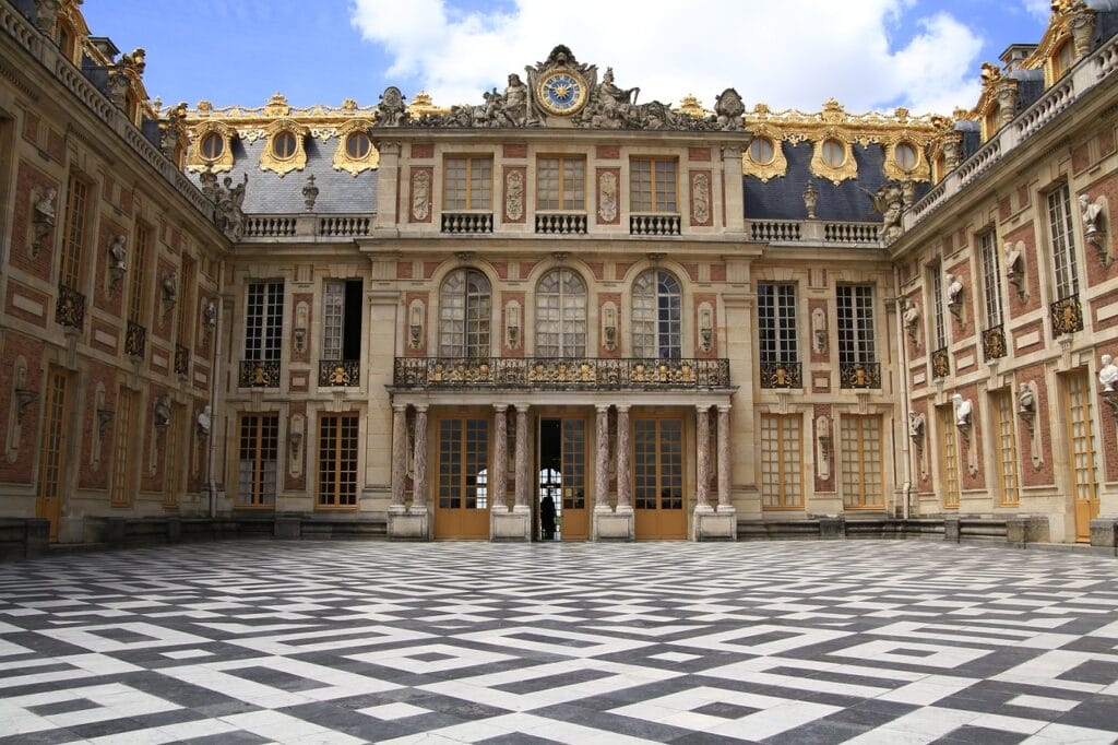 Golden entrance of the Palace of Versailles, a fantastic destination for a day trip from Paris.