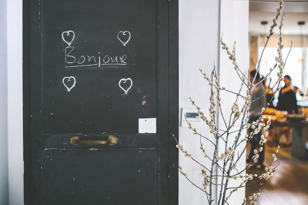 Bonjour written on black door