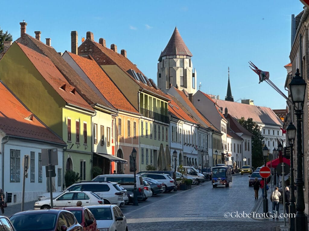 Colored two story buildings with red roofs in the castle district in Budapest Hungary