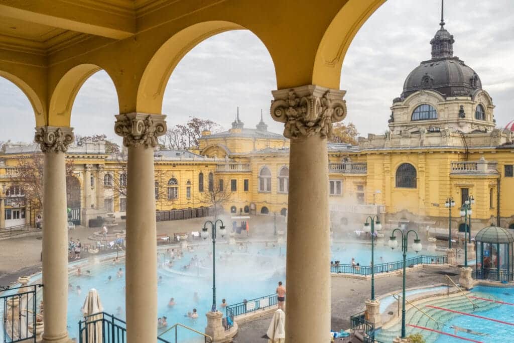 Szechenyi Baths in Budapest, Hungary. Historic Hungarian thermal baths in Europe. People enjoying thermal baths in Budapest.