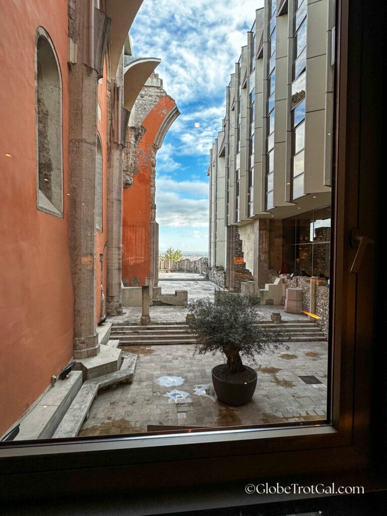 View out a hallway window of the Hilton in Budapest Hungary showing ruins of the arches of a 13th century cloister
