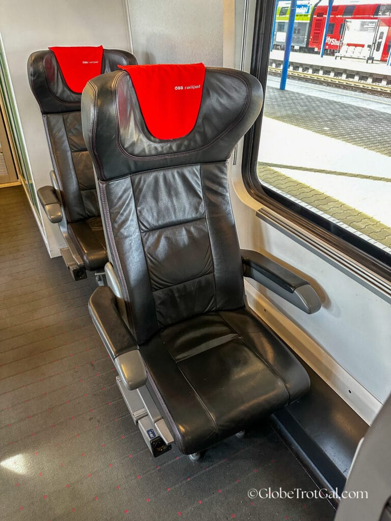 First class black leather solo train seat in OBB Railjet train.