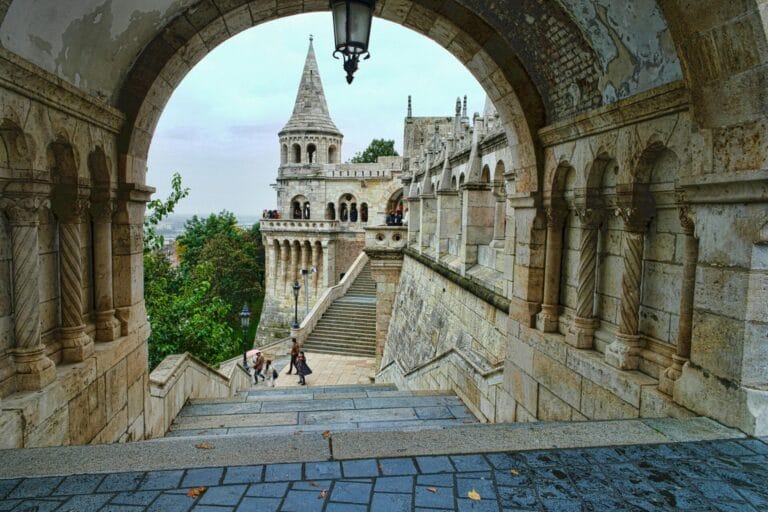 Turret at Fisherman's Bastion seen through a stone arch in the Buda Castle District in Budapest Hungary