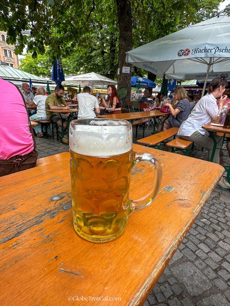 Stein of beer at the Viktualenmarkt beer garden in Munich Germany